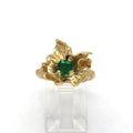 Blossom set with an emerald
