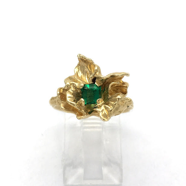 Blossom set with an emerald