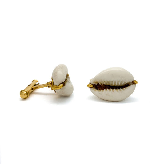 Cowry shell cuff links, an ancient form of money