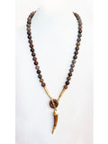 Petrified dinosaur bone beads with a Pterosaurs Tooth