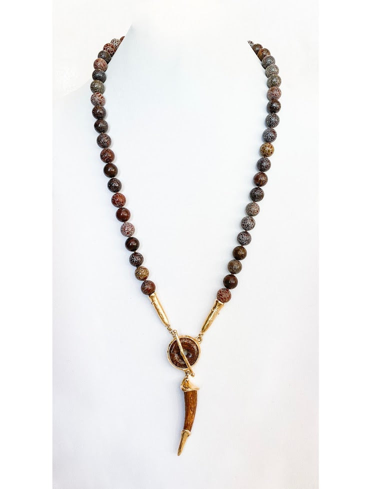 Petrified dinosaur bone beads with a Pterosaurs Tooth