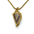 Fossilized sea shell with a Druzy surface set in 18K gold. Druzy is a natural surface of tiny crystals that sparkle like dew on a morning meadow.