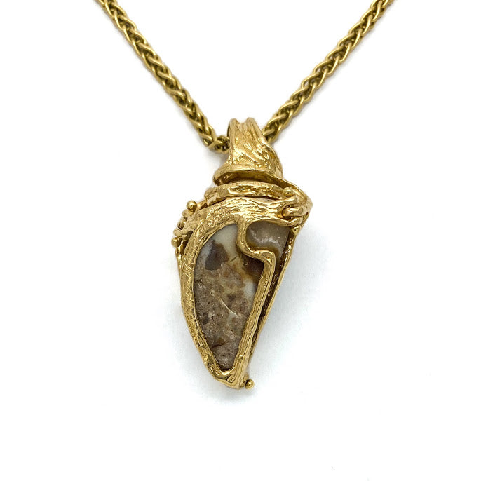 Fossilized sea shell with a Druzy surface set in 18K gold. Druzy is a natural surface of tiny crystals that sparkle like dew on a morning meadow.