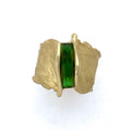 Bright green scissor cut tourmaline set into a feather texture ring