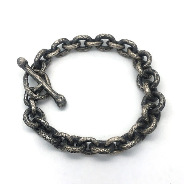 Bracelet composed of heavily textured round and oval sterling links