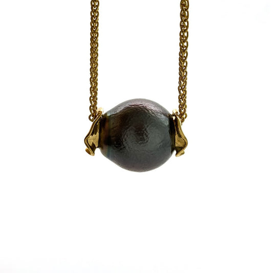 Baroque black Tahitian pearl with an orange peal texture