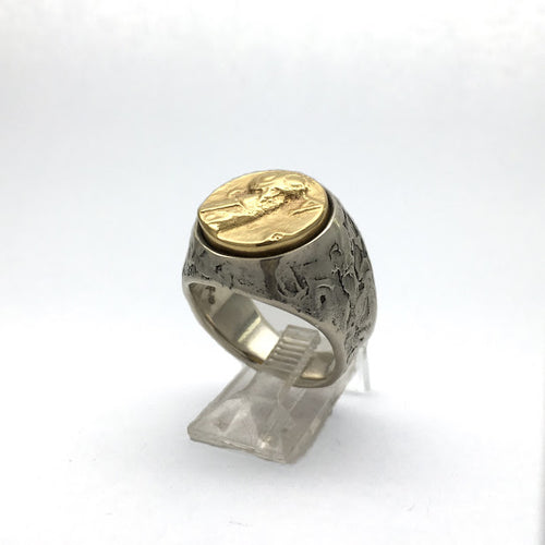 Athenian owl set into a pallet knife textured sterling band