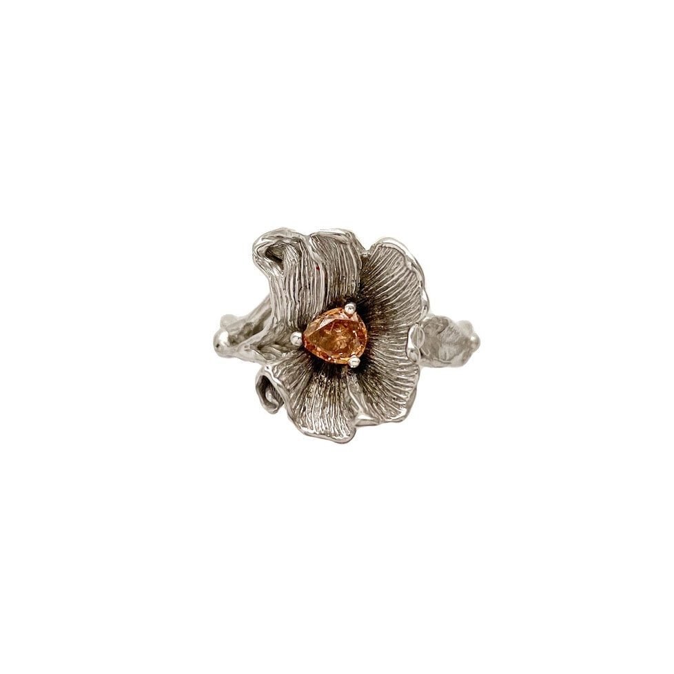 Blossom with a string of leaves around the band set with fancy brown orange diamond