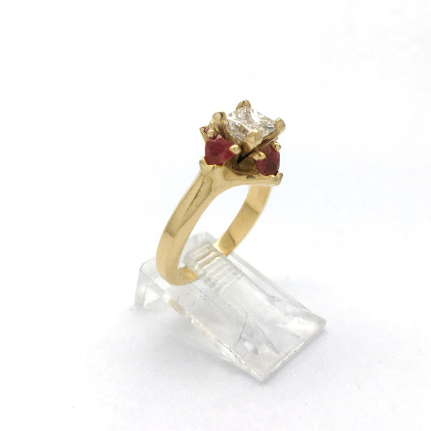 Princess cut surrounded by heart shaped rubies