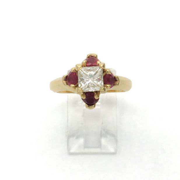 Princess cut surrounded by heart shaped rubies