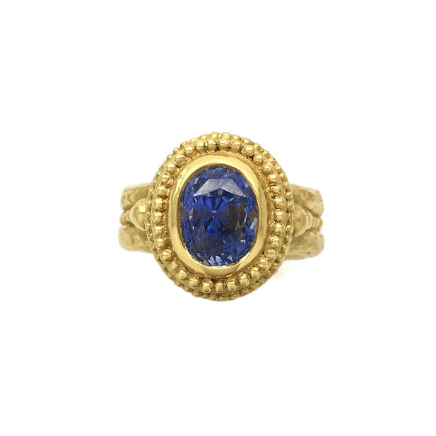 Caste granulation band set with blue sapphire
