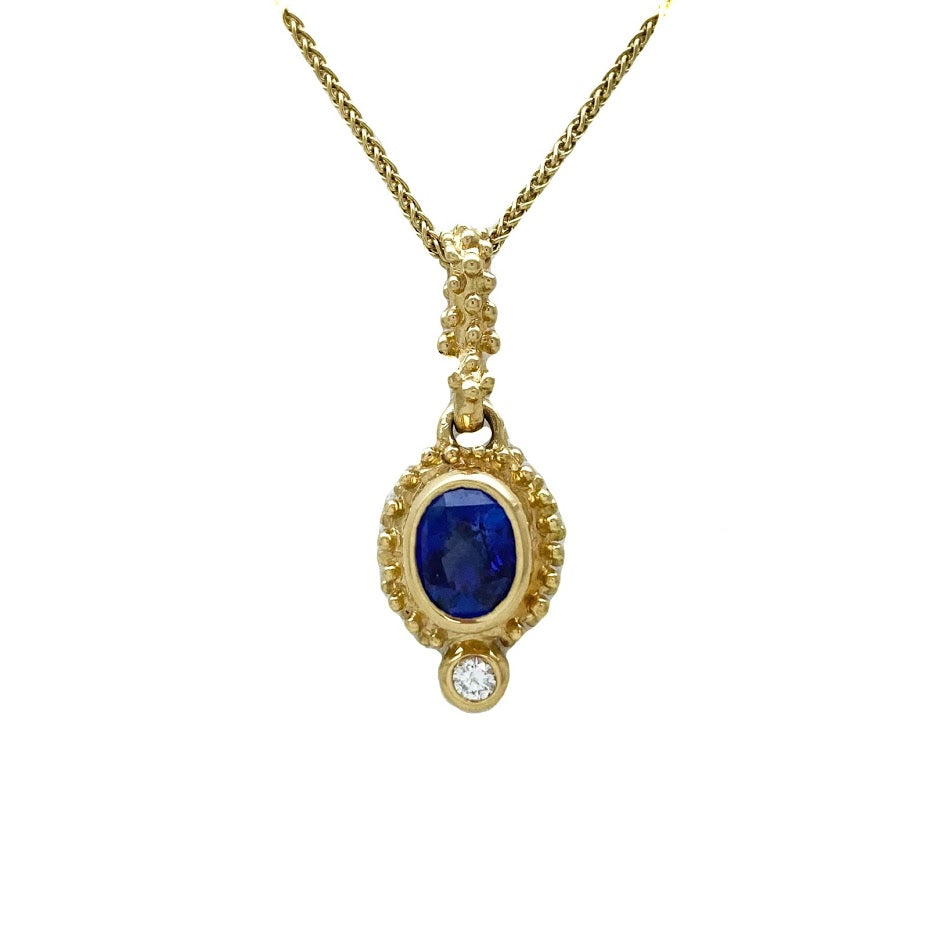 Sapphire and diamond set in caste granulation