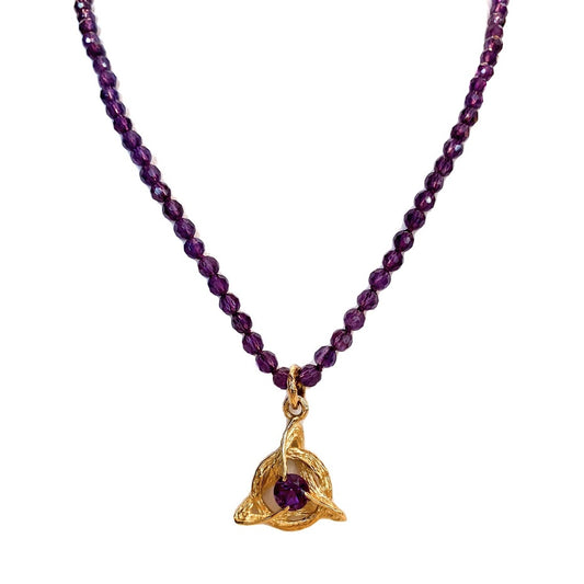 Sobriety symbol set with an amethyst on an amethyst beaded necklace