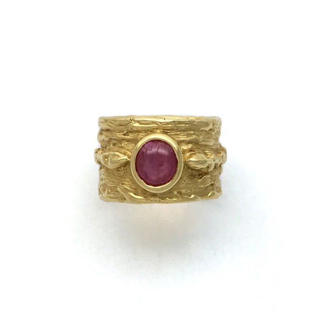 Bark texture ring with twigs and buds bezel set with a ruby cabochon