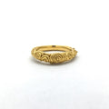 Simple tapered band surfaced with spirals and mock granulation elements inspired by antiquity