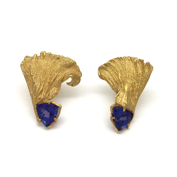 Mismatched feathered earrings set with trillion Tanzanites