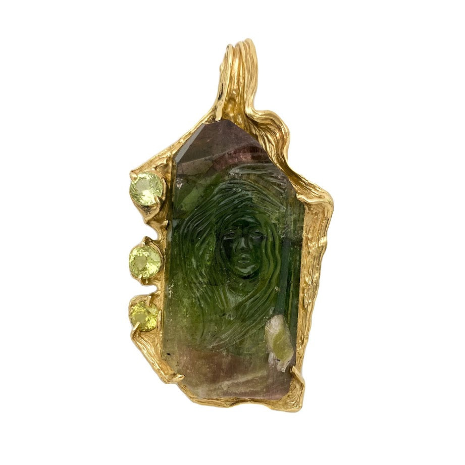 A Hand Carved Female Face into a Tourmaline