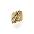 Climbing vine on a fluid band set with diamonds