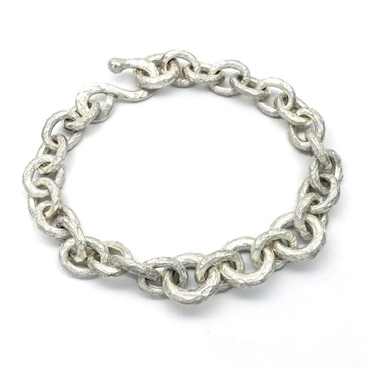 Bracelet composed of heavily textured round and oval links