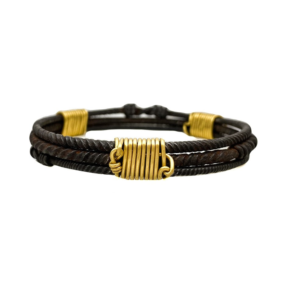 Three old African wrought iron "money" bracelets lashed together with 22K gold wires